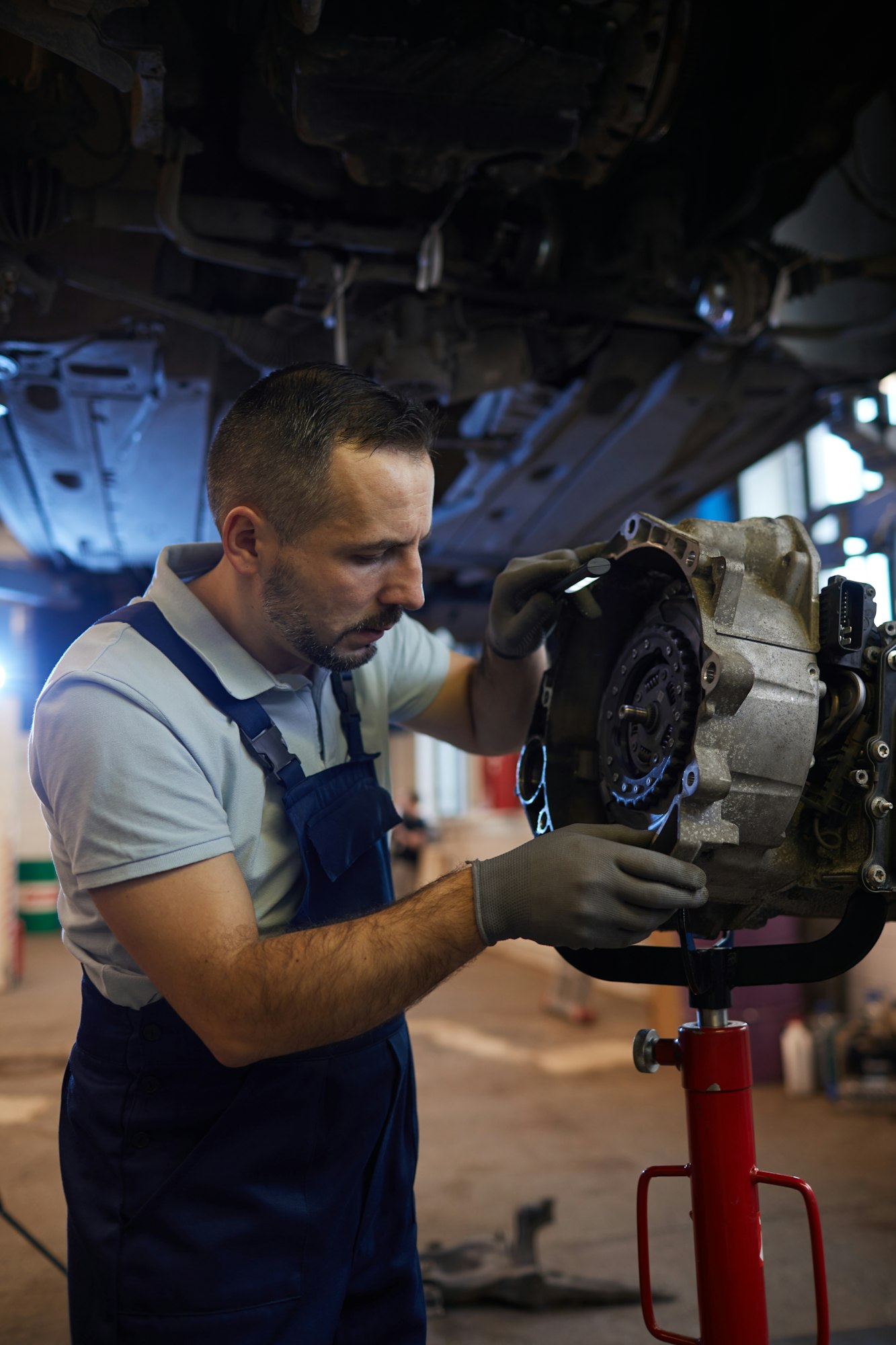 Mechanic Repairing Car on Lift