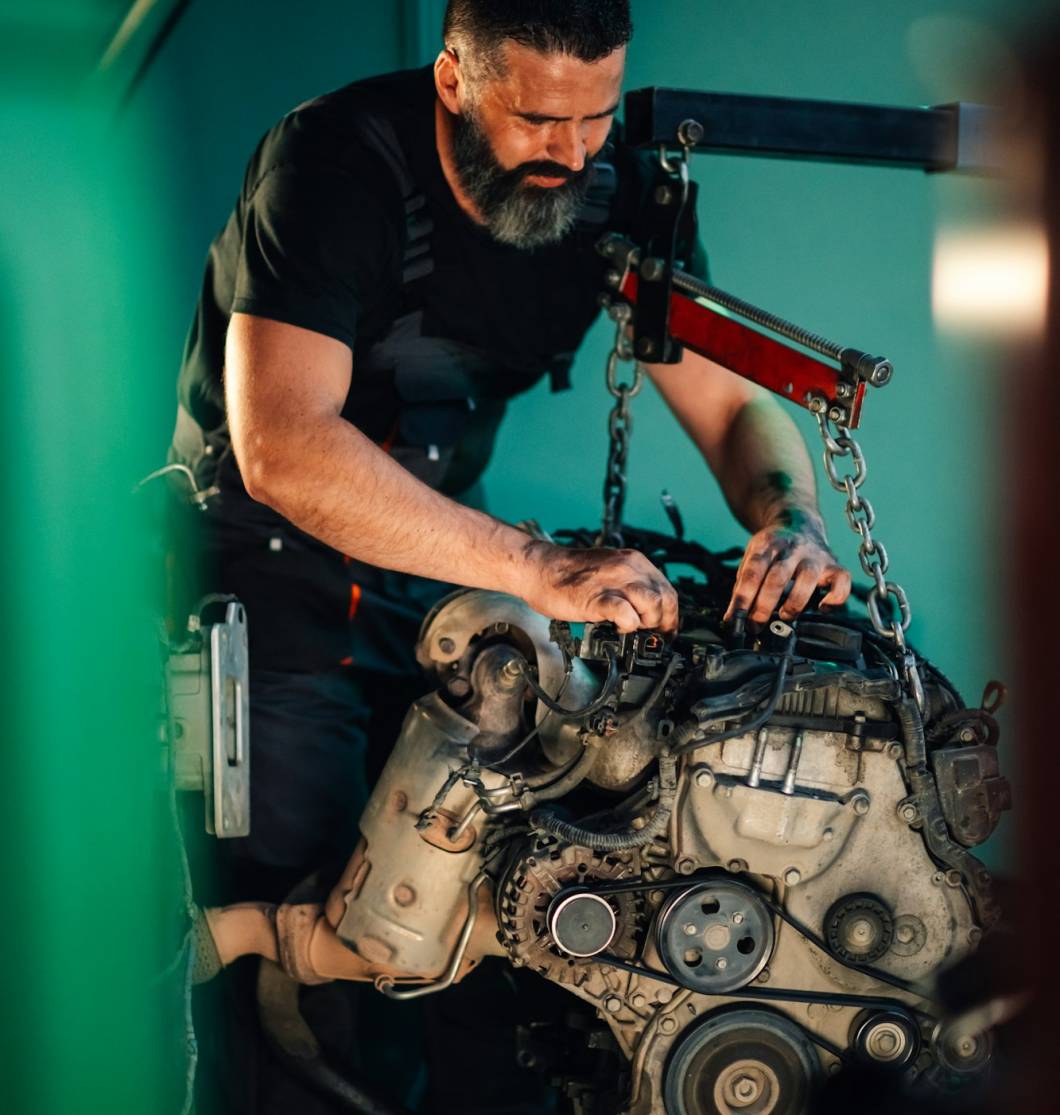 Detailed mechanical repairs by a mechanic in the night garage